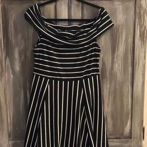 Off the shoulder, black and white midi dress.